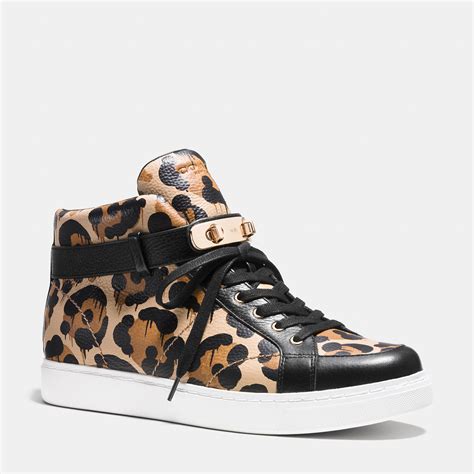 high top coach sneakers.